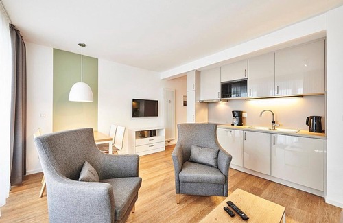 Bensersiel Appartement | Vacation apartment close to the beach with large balcony incl. use of swimming pool & sauna - Deichhäuser Anna