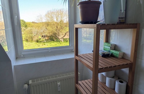 Carpin Appartement | Vacation apartment in a cozy farmhouse by the bathing lake with large garden and sauna