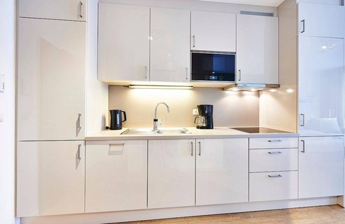 Bensersiel Appartement | Vacation apartment near the beach with terrace incl. free use of swimming pool & sauna - Deichhäuser Anna