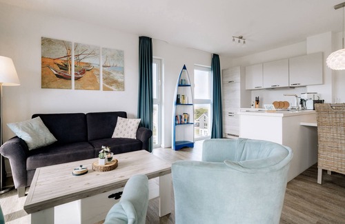 Schillig Appartement | Vacation apartment with a view of the sea and meadows, sauna & electric fireplace for relax