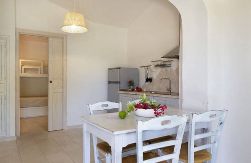 La Conia Maison | Maison de vacances "Casa giardino e spiaggia a piedi" près de la plage avec jardin et terrasse