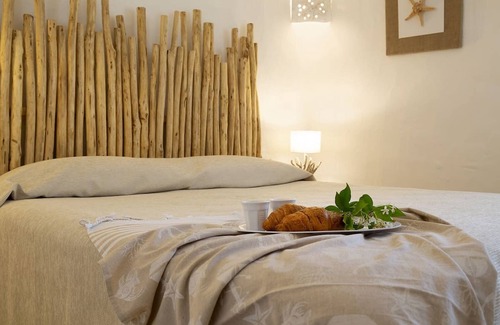 La Conia Maison | Vacation Home "Casa giardino e spiaggia a piedi" near the Beach with Garden & Terrace