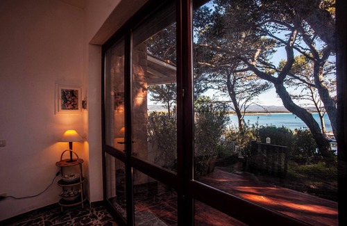 Porto Pino Villa | Maison de vacances 'Fronte Mare Al Porticciolo' avec vue sur la mer, barbecue et Wi-Fi