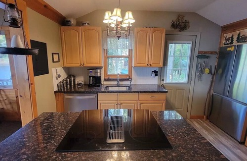 Pittsfield Maison | Vasha is a cozy pet-friendly lake house for relaxing in a secluded location.