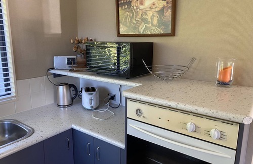Papamoa Beach Maison | Appartement d'une chambre. Réserve de frontières.