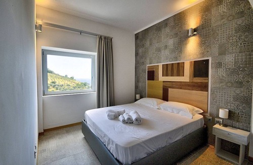 Serramezzana Maison | Villa Alfea E, fully refundable with voucher*: A welcoming apartment situated in a secluded location surrounded by meadows and by green hills, with Free WI-FI.