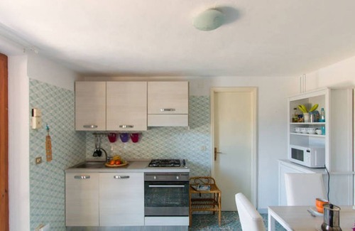 Magazzini Appartement | Villa Giolù: appartement corail à 200m de la mer, réduction sur le ferry BlueNavy