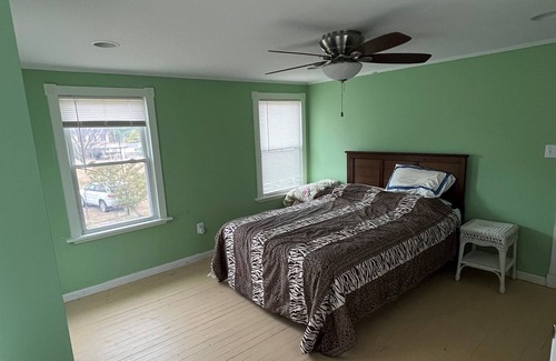 Piney Point Maison | Waterfront cottage with private pier, fireplace, and large yard.