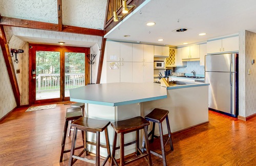 Barnstead Maison | Waterfront home with wraparound deck, floating fireplace, deck, & firepit