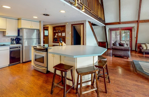 Barnstead Maison | Waterfront home with wraparound deck, floating fireplace, deck, & firepit