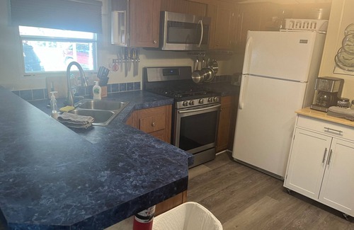 Satsuma Maison | Waterfront home in Satsuma. Two bedrooms each with full bath. Gas grill.