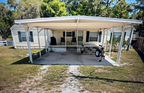 Satsuma Maison | Waterfront home in Satsuma. Two bedrooms each with full bath. Gas grill.
