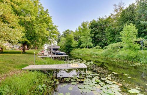 Isle Maison | Waterfront Wahkon Home with Wraparound Deck and Docks