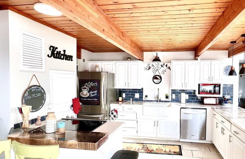 Center Ridge Maison | Watershed Getaway on lake, mountain behind house on property, and hiking trails