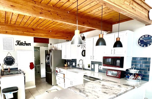 Center Ridge Maison | Watershed Getaway on lake, mountain behind house on property, and hiking trails