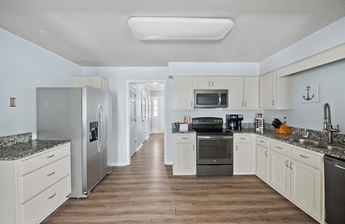 Cottage Line Maison | Welcome to the Captain's Quarters, a 4 BR luxury furnished monthly rental.