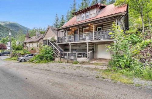Kellogg Maison | Where We Roam Log Cabin with Mountain Views