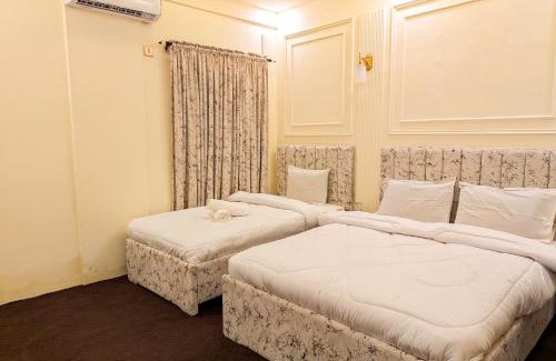 Gulshan-E-Jamal Lit Et Petit-Déjeuner | White Rose BNB - Airport Branch Karachi