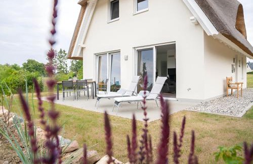 Am Salzhaff Maison | Wiesenpieper - Ferienhaus mit Kamin, Sauna und Meerblick