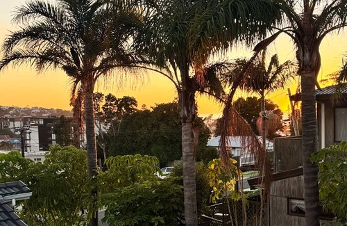Browns Bay Cottage | Your coastal escape. Walk to the beach. Private spa, whole house access.