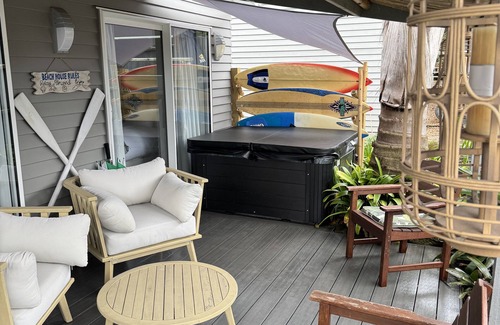 Browns Bay Cottage | Your coastal escape. Walk to the beach. Private spa, whole house access.