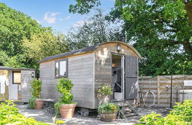Open plan shepherds hut, oozing charm, with a wood burner and wood-fired hot tub.