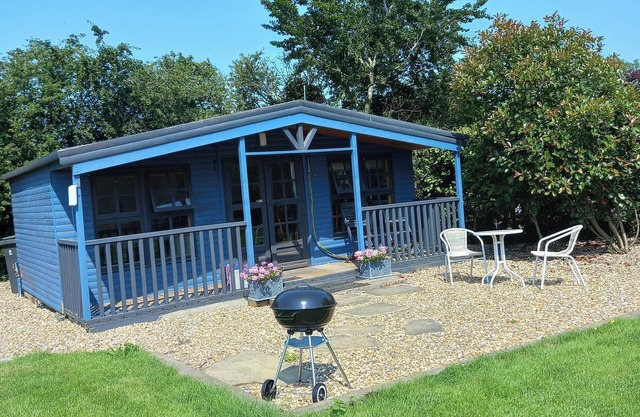 Newly refurbished cabin with open green space included.