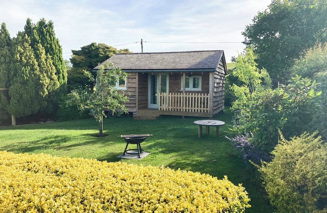 A fabulously quirky, hand built lodge full of modern features and with beautiful views.
