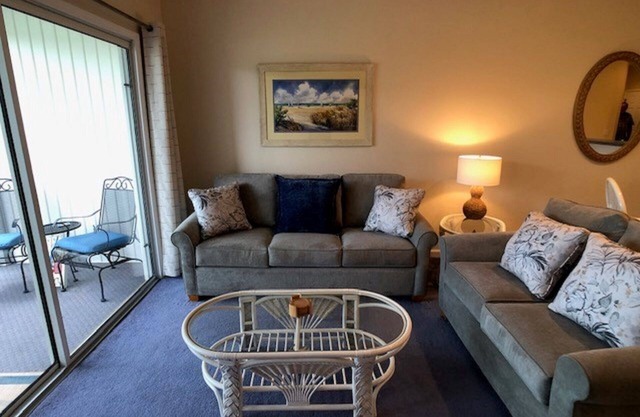 2 BDRM Sunset Beach Condo: Terrasse avec vue sur le 10ème trou Jones / Byrd.