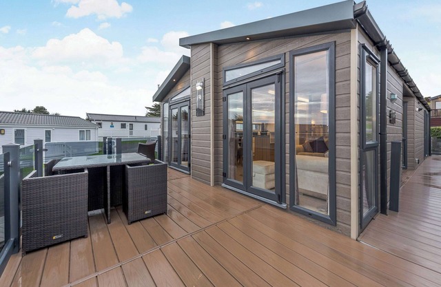 Experience coastal luxury in this two-bedroom lodge at Landscove Holiday Park, Brixham.