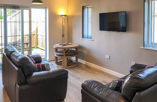 Comfortable modern cottage with one king-size double and one with adult size bunks.