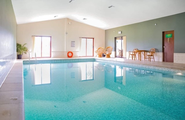 Spacious luxury lodge with one king-size and one double, one with en suite shower.