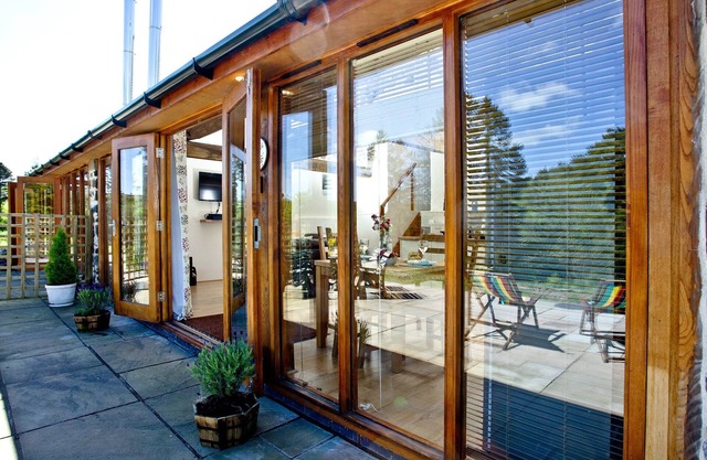 A well-appointed eco-lodge complete with wood burner, solar panels and stunning views.
