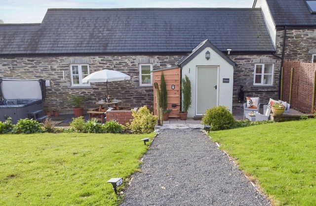 Picked for its character finish, Y Bwthyn also boasts a hot tub.