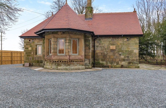 We love this historic lodge with large garden and wood fired hot tub.