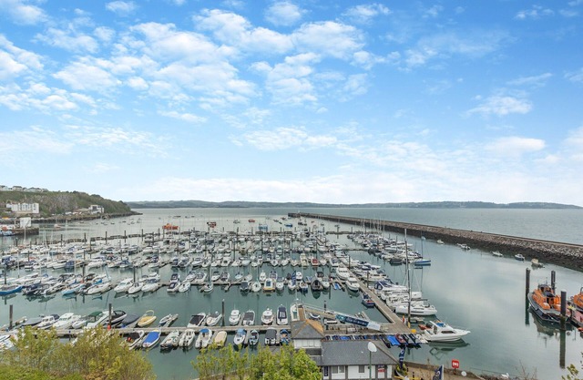 Escape to a 2-bed holiday home in Brixham, boasting stunning sea views and convenient parking.