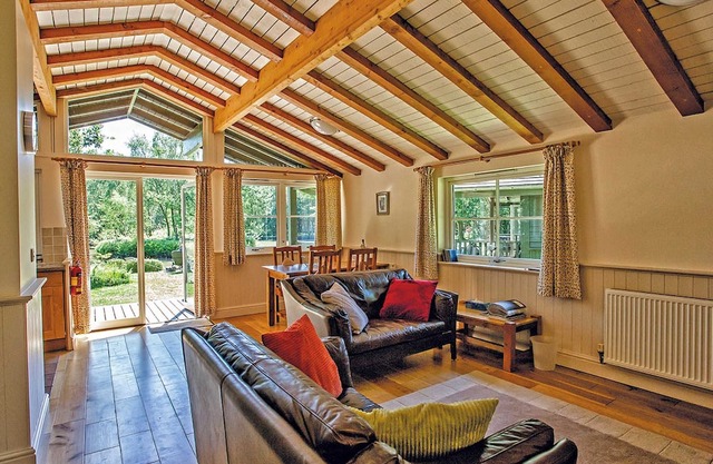 This comfortable lodge features one double bedroom with an en suite shower and a twin bedroom.