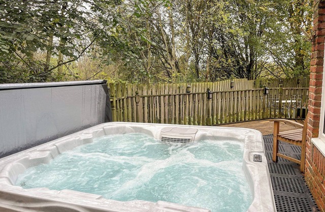 A wonderfully spacious apartment with hot tub and an enclosed, sunny sitting-out area.