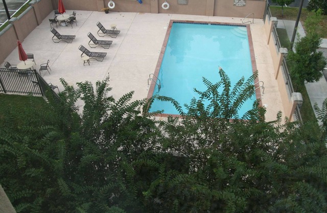 2 Connecting Suites with Three Beds and Two Sofabeds at a Full Service Hotel by Suiteness