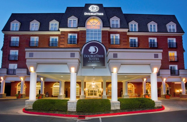 2 Connecting Suites with Three Beds and Two Sofabeds at a Full Service Hotel by Suiteness