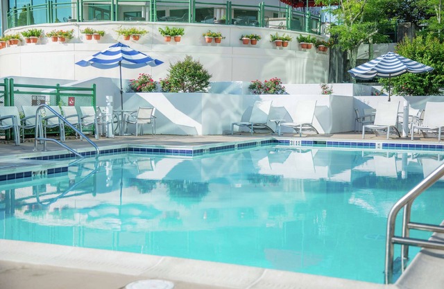 2 Connecting Suites with 4 Beds and Two Sofabeds at a Full Service Hotel by Suiteness