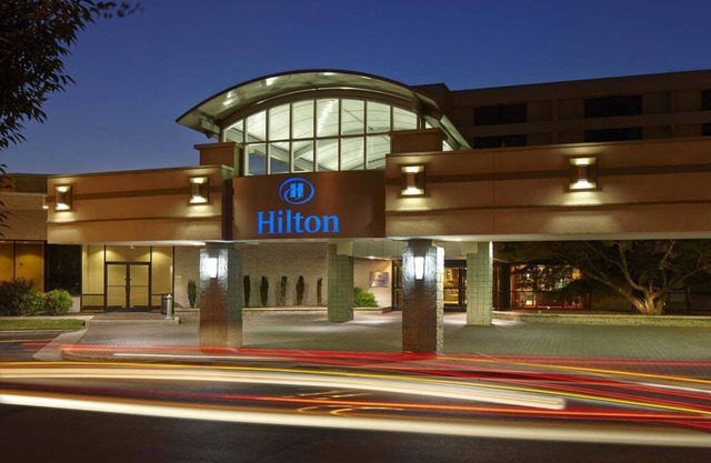 2 Connecting Suites with Two Beds and One Sofabed at a Full Service Hotel by Suiteness