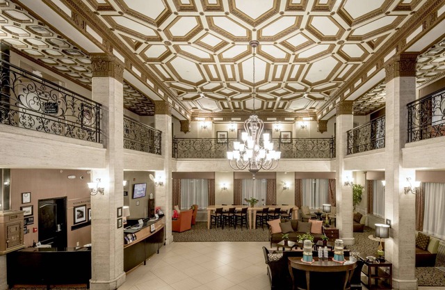 2 Connecting Suites with Three Beds and Two Sofabeds at a Full Service Hotel by Suiteness