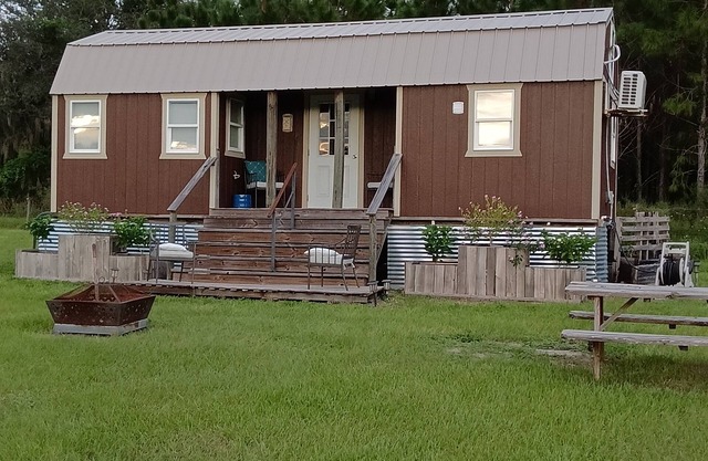 New luxury Tiny House(s) on 6 acres with horses. Sunsets,fire pit, & Hot tub.