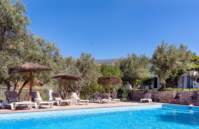 200 year old farmhouse · olive groves · mountain views · gated pool · near town