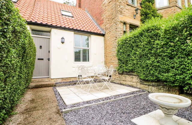 22A TAYLORS COTTAGE, pet friendly, with a garden in Whitley Bay