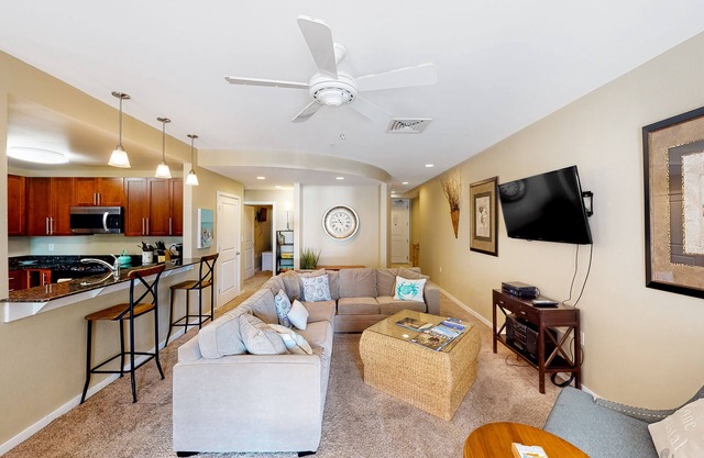 2nd-floor bay- & ocean-view condo with balcony, outdoor pool, grills & gym