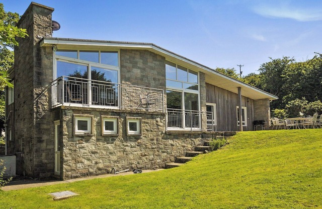 A 1960’s contemporary style Nolton Haven coastal cottage in extensive grounds near Nolton Beach.