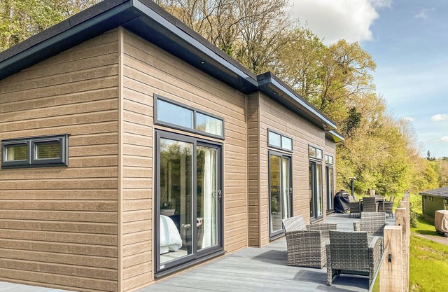A luxury three-bedroom lodge with a modern central lounge layout, perfect for families and couples.