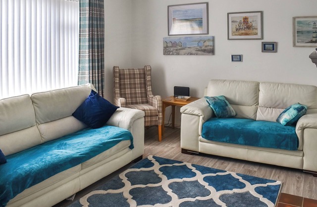 A tastefully decorated property with a pretty garden and a sun house, situated close to the beach.